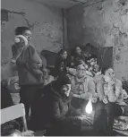  ?? EVGENIY MALOLETKA/ AP ?? People settle in a bomb shelter in Mariupol, Ukraine, this month.