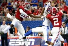  ?? AP FILE PHOTO/
JOHN BAZEMORE ?? In this 2019 file photo, Alabama defensive backs Jared Mayden (21) and Patrick Surtain II (2) break up a pass intended for Duke wide receiver Jalon Calhoun (5) during the first half an NCAA college football game, in Atlanta.