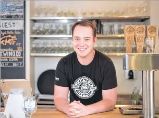  ?? NATHAN ROCHFORD/SALTWIRE NETWORK ?? Isaac MacIntyre, business developmen­t officer with Copper Bottom Brewing, poses for a portrait during a recent visit to the brewery.