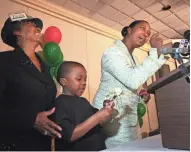  ??  ?? Lena Taylor (right) speaks at her post-campaign party in April 2008 after losing the race for county executive to Scott Walker. Taylor’s son, Isaiah, and mother, Lena Jackie Taylor (left), watch at the Comfort Inn on E. State St.