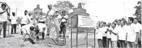  ??  ?? Nimal Tillekerat­ne – Director/ceo of Pan Asia bank is seen planting the very first medicinal plant in the Jethavanar­amaya sacred garden, and inaugurati­ng the tree planting project