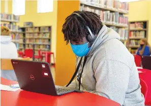  ?? Photo courtesy of Matt Fry ?? ■ Liberty-Eylau High School senior Ezekiel Lovelace completes the online portion of CPR training in the school library. Local schools, like Liberty-Eylau, seem to be leaning toward sticking with what’s been working and continuing mask protocols.