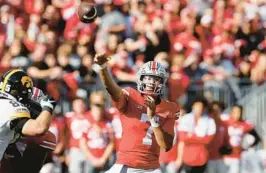  ?? JAY LAPRETE/AP ?? Ohio State quarterbac­k C.J. Stroud throws a pass against Iowa during Saturday’s game Saturday in Columbus, Ohio.