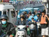  ?? TATAN SYUFLANA/AP ?? The U.N. said the world’s population will hit 9 billion in 2037. Above, traffic in Jakarta, Indonesia.