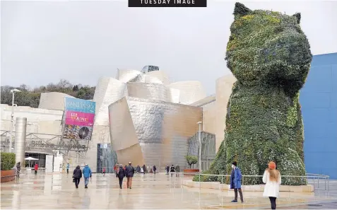  ?? | EPA-EFE ?? VISITORS at the Guggenheim Museum in Bilbao, Spain, yesterday. According to the 2020 Spanish Museums report on visitors, a total of 315 908 people visited the Guggenheim Bilbao Museum last year, 73% less than in 2019, during which it registered a total of 1 170 669 visitors. The museum was also closed for three months due to the Covid-19 pandemic.