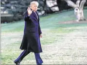  ?? ERIK S. LESSER / GETTY IMAGES ?? President Donald Trump waves as he walks across the South Lawn toward the White House in Washington on Sunday, after returning from a weekend at his estate in Palm Beach, Fla.