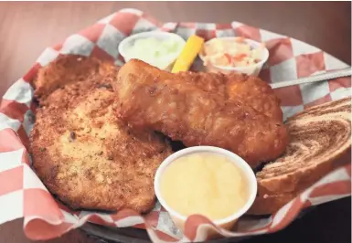  ?? MICHAEL SEARS/MILWAUKEE JOURNAL SENTINEL ?? Fish fry like this cod can be ordered with the house potato pancakes instead of the standard, the house potato chips, at the North Lake Bear Trap in Waukesha County.