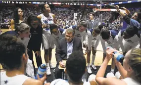  ?? Jessica Hill / Associated Press ?? UConn head coach Geno Auriemma, center, talks to his team at the end of the first quarter against Oklahoma Tuesday night in Uncasville.