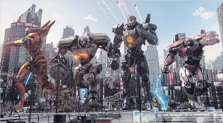  ?? LEGENDARY PICTURES UNIVERSAL PICTURES ?? Giant robots, known as Jaegers, must defend the world from monsters from another dimension in "Pacific Rim: Uprising." From left, Saber Athena, Bracer Phoenix, Gipsy Avenger and Guardian Bravo.