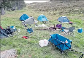  ??  ?? Balmoral rangers’ photo of tents and rubbish on estate grounds