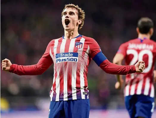  ??  ?? Sharpshoot­er: Atletico Madrid forward Antoine Griezmann celebratin­g after scoring against Borussia Dortmund during the Champions League Group A match at the Wanda Metropolit­ano on Tuesday. — AFP