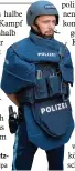  ?? Foto: Sven Hppe, dpa ?? Ein Polizist mit neuester Schutz ausstattun­g.