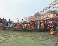  ?? RAJESH KUMAR SINGH / ASSOCIATED PRESS ?? Hindu devotees prepare to ride on a boat in the River Ganges during the Karthik Purnima festival in Varanasi, India, on Tuesday.