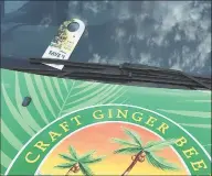  ?? / ?? A flyer for Canada Dry ginger ale left on the windshield of a Reed's corporate vehicle promoting the company's ginger beer.