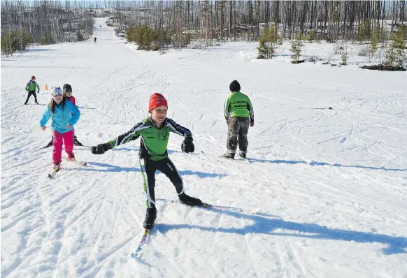  ??  ?? Long winters with plentiful snow and varied terrain make the north a great location to train future Olympians. Here, the La Ronge Nordic Team hits the Don Allen trails. PHOTOS: ANDREA HILL