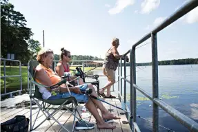 ??  ?? right
Sue Gravette, Carla Garner and Audri Mayo enjoy fishing Tuesday at Elliot Lake.