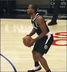  ?? KEVIN REECE Special to the Valley Press ?? MR. 10,000 The Clippers’ Kawhi Leonard looks to set up a play against the Chicago Bulls at Staples Center on Sunday. Leonard scored a seasonhigh 35 points, passing 10,000 career points in the Clippers’ 130127 victory.