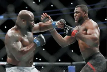  ?? JOHN LOCHER — ASSOCIATED PRESS ?? Francis Ngannou, right, fights Derrick Lewis during a heavyweigh­t bout at UFC 226 on July 7 in Las Vegas.