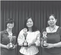  ??  ?? (From left) Moh, Ho and Lau with the prizes they won in a public speaking contest.