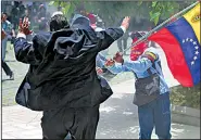  ?? AP/FERNANDO LLANO ?? Venezuelan pro-government militiamen attack opposition lawmaker Franco Casella as they storm the congressio­nal building in Caracas during a special session Wednesday, the country’s independen­ce day.