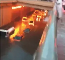  ??  ?? The video showed more than a dozen vehicles submerged in an underpass with police sirens blaring in the background.