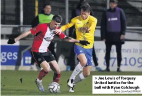  ?? Dave Crawford/PPAUK ?? > Joe Lewis of Torquay United battles for the ball with Ryan Colclough