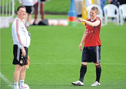  ??  ?? Louis van Gaal, left, and Bastian Schweinste­iger at Bayern Munich.