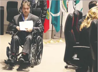  ?? TONY CALDWELL FILES ?? Coun. Rick Chiarelli leaves a council meeting in his wheelchair in February.