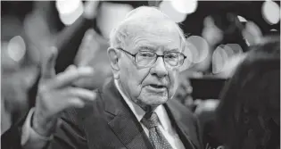  ?? JOHANNES EISELE/AFP/GETTY IMAGES ?? From Black this year, John Dorfman selects Berkshire Hathaway Inc., (BRK.A and BRK.B): “One reason I like Berkshire is that I expect its chairman, Warren Buffett, to do some rescue missions of other companies, as he did for Goldman Sachs and General Electric in the Great Recession of 2007-2009.”