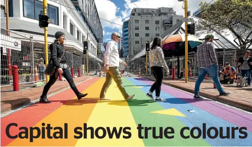  ?? MONIQUE FORD/STUFF ?? Wellington City Council urban design and developmen­t manager Amy Hobbs, left, council chief executive Kevin Lavery, and Wellington­ians Rachel Gifford and Nathan Muckley channel The Beatles on the new rainbow crossing in the capital.