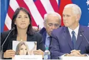  ?? CARL JUSTE/POOL PHOTO ?? Venezuelan exile Maria Eugenia Tovar talks about the slaying of her daughter in 2014 as Vice President Mike Pence listens during Wednesday’s visit to Doral.