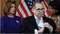  ?? (Jonathan Ernst/Reuters) ?? DEMOCRATS NANCY PELOSI, Maxine Waters and Jerrold Nadler reveal articles of impeachmen­t yesterday.