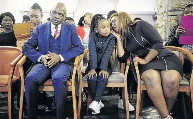  ?? THULANI MBELE ?? Former SABC COO Hlaudi Motsoeneng with his children, Reamohetsw­e and Lerato, at a church service at BDM Ministries in Ackerville, Emalahleni, yesterday.