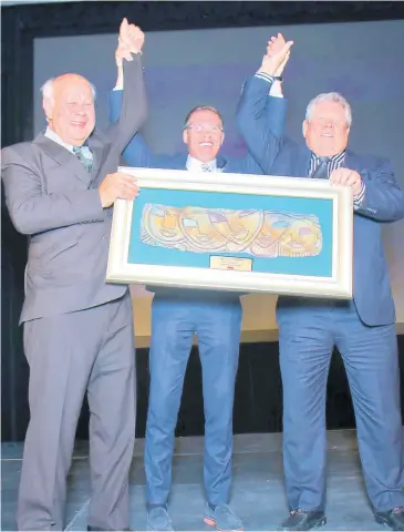  ?? PHOTOS BY ASHLEY ANGUIN ?? Throwback: Happiness Unlimited: Pioneer Awardee 2017 Gordon ‘Butch’ Stewart (right); his son, Adam (centre); and former chairman of The Gleaner Company (Media) Limited, Oliver Clarke, raise their hands in celebratio­n at the 2017 Hospitalit­y Jamaica Awards at the Montego Bay Convention Centre.