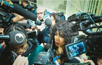  ?? PIERO CRUCIATTI/GETTY-AFP ?? Politician not guilty: Performer Marysthell Garcia Polanco meets the media Wednesday at a Milan courtroom after former Italian Premier Silvio Berlusconi was found not guilty of witness tampering in a trial related to sexually charged parties held at his villa while in office. The decision ended a six-year trial for Berlusconi, 86, who was not in court.