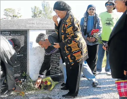  ?? Picture: EUGENE COETZEE ?? NOT FORGOTTEN: About 60 people gathered at the Papenkuil cemetery to commemorat­e the 26th anniversar­y of the northern areas riots and remember 48 of the people who lost their lives. Brenda Allison, 71, centre, cries over the loss of her brother,...