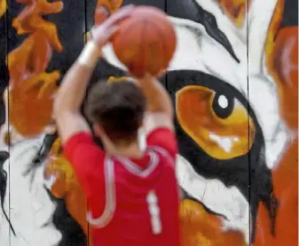  ?? Matt Freed/Post-Gazette ?? Neshannock’s Cam’Ron Owens warms up before tipoff against host Beaver Falls Friday. Neshannock won, 50-35, behind a stellar defense.