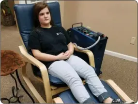  ??  ?? Emma is demonstrat­ing two different positions used when addressing migraines and both are equally effective. The choice between being seated comfortabl­y in a chair, or relaxing privately on a bed is made based on personal preference and specific...