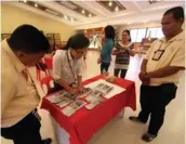  ??  ?? DTI Representa­tive Gladys Oro with The
FREEMAN's Joseph Dematera and Dick
Batucan.