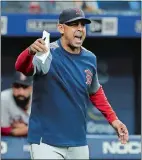  ?? CHRIS O'MEARA/AP PHOTO ?? Boston Red Sox manager Alex Cora screams at the umpires during the eighth inning of Wednesday’s game against the Tampa Bay Rays at Petersburg, Fla. Cora was upset about the Rays moving pitcher Adam Kolarek to first base and then back to pitcher during the inning.