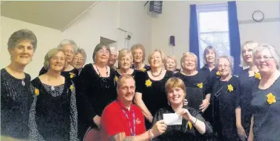  ??  ?? Cytgord ladies’ choir hands over a cheque to Welsh Hearts Charity and are next holding a fundraisin­g concert for Tenovus next month