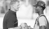  ?? STEPHEN M. DOWELL/STAFF PHOTOGRAPH­ER ?? Speedy Dr. Phillips QB Marvin Washington, right, fits right in with UCF coach Scott Frost’s UCFast approach.