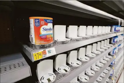  ?? Associated Press ?? Shelves typically stocked with baby formula sit mostly empty at a store in San Antonio last month. Parents across the U.S. are scrambling to find baby formula because supply disruption­s and a massive safety recall have swept many leading brands off store shelves.