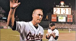  ?? DENIS PAQUIN/AP ?? Cal Ripken Jr. waves to the crowd, playing in his 2,131st straight game on Sept. 6, 1995.