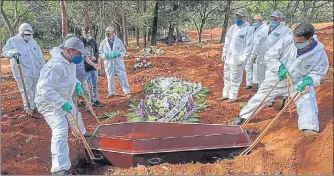  ?? AFP ?? A Covid-19 victim is buried at a cemetery on the outskirts of Sao Paulo, Brazil, on Wednesday.