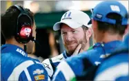  ?? AP PHOTO BY AJ MAST ?? Dale Earnhardt Jr. (88) talks with his crew after dropping out of the NASCAR Brickyard 400 auto race at Indianapol­is Motor Speedway in Indianapol­is, Sunday.