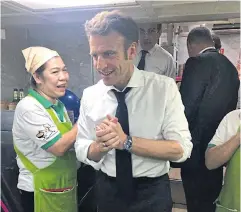  ?? HUA SENG HONG FACEBOOK PAGE ?? Mr Macron is pictured mingling with staff at Hua Seng Hong restaurant.