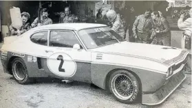  ?? BILD: SN/JOSEF MAYRHOFER ?? Der Ford Capri vor 50 Jahren an der Box am Salzburgri­ng: Jochen Mass übergibt an Niki Lauda.