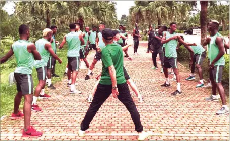  ??  ?? Eagles and their coaches loosening up with light warm up on arrival in Uyo yesterday