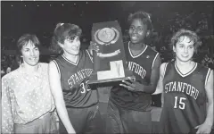  ?? COURTESY OF STANFORD ATHLETICS ?? Stanford women’s basketball head coach Tara VanDerveer, left, celebrates her team’s 1992 NCAA championsh­ip win with three players.